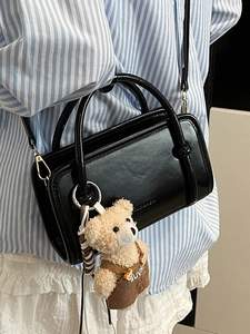 Minimalist black PU leather doctor bag with a plush bear charm for daily casual commute
