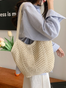 Chic woven beige tote bag with a hollow knit design for a casual summer beach look