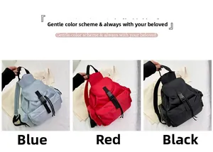 Three minimalist nylon backpacks displayed in blue, red, and black with buckle closures
