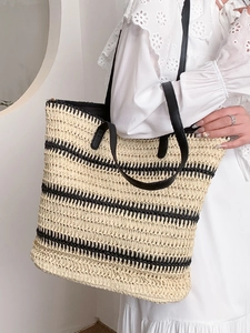 Fashion woven straw tote bag with black stripes and leather straps for summer vacations
