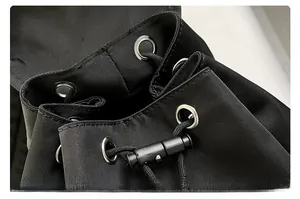 Detail of high-density nylon backpack drawstring closure with silver metal eyelets