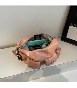 Interior view of spacious multi-pocket leather tote bag showing storage for laptop and items