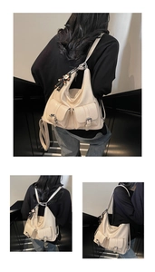 Detail view of cream white faux leather tote bag with functional buckled front pockets