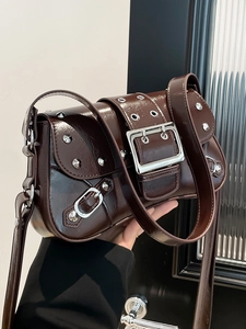 Deep brown patent leather punk baguette bag with silver studs and large buckle details