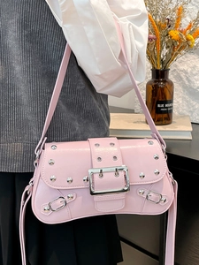Pink Y2K motorcycle style shoulder bag with silver studs and metal buckle detail