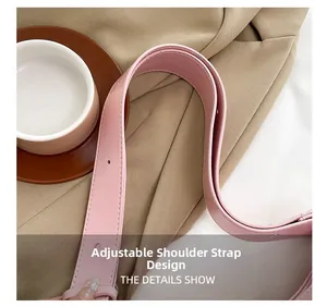 Detail of adjustable pink leather strap with precise stitching and refined metal holes