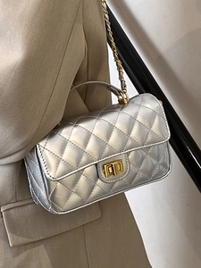 Silver metallic quilted flap handbag with golden twist lock and chain strap for women