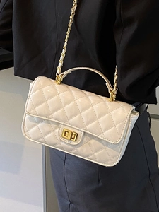 Elegant cream patent leather quilted handbag with gold chain strap for women