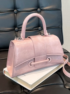 Pink textured handbag with minimalist square design and elegant top handle for women