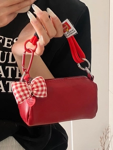 Borsa a cilindro in pelle rossa con manico a nodo e dettaglio fiocco a scacchi