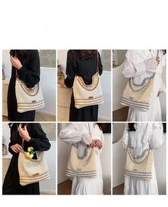 Detail of hollow woven shoulder bag featuring bicolor stripes and wooden bead decoration