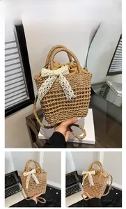 Close-up of woven straw handbag with white lace bow and drawstring inner lining