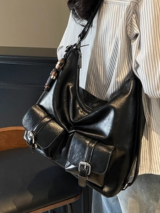 Chic black glossy oil wax leather hobo tote bag with multiple front pockets and silver hardware