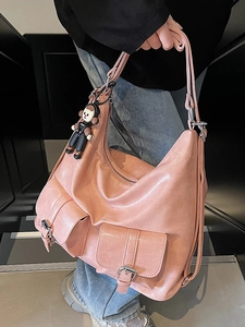 Pink waxed leather hobo tote bag with multiple pockets and fashionable shoulder straps