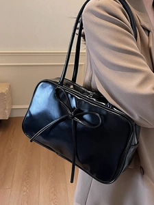 Minimalist black ribbon bow Boston bag in glossy PU leather with slender shoulder straps