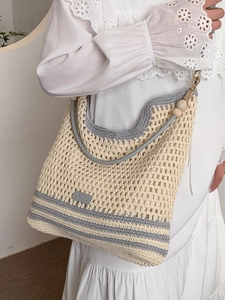 Chic hollow woven crossbody bag with cream and blue stripes and wooden bead detail