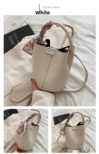 Detail view of lychee texture bucket bag with printed silk scarf wrap on handle