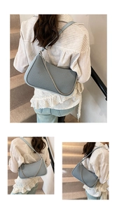 Detail of light blue woven texture shoulder bag with stylish silver chain strap decoration