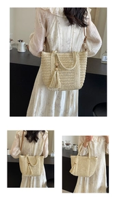 Detail of hand-woven straw tote bag featuring decorative wooden beads and leather strap