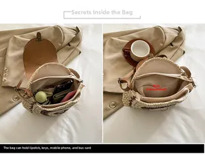 Detail view showing internal storage of woven straw bag for phone, keys and lipstick