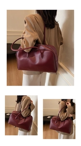 Three-way view of a large burgundy leather hobo bag with textured lychee grain