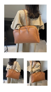 Detail of vintage brown leather hobo bag showing the large capacity and pebble texture