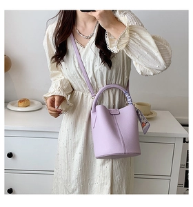 Chic light purple bucket bag with silk scarf handle detail and detachable strap