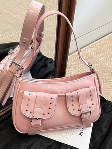 Pink Y2K shoulder bag with silver studs and double front pockets on mirror surface
