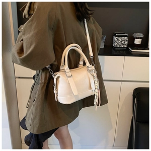 Detail of off-white faux leather Boston bag with embossed logo and striped silk scarf