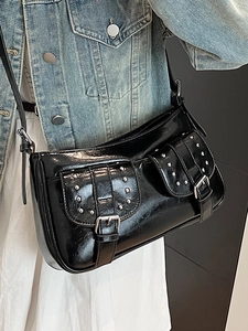 Glossy black motorcycle style underarm bag with silver rivets and metal buckles