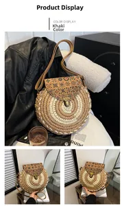 Detail of khaki round straw shoulder bag with vintage ethnic floral print and bronze clasp