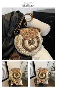 Detail of round straw crossbody bag with bohemian floral pattern and metal buckle closure