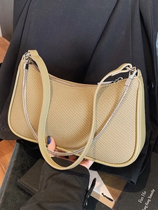 Chic woven underarm bag with green leather trim and silver chain strap for women