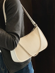 Elegant beige chain hobo bag for women featuring a minimalist weave texture and gold strap