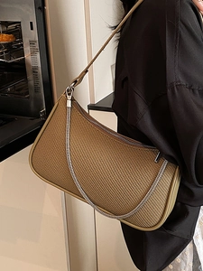 Minimalist khaki woven underarm bag with silver chain strap and zipper closure