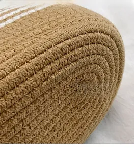 Detail showing the brown and white cotton rope weaving texture of the tote bag