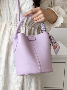 Light purple lychee leather bucket bag with silk scarf handle and crossbody strap