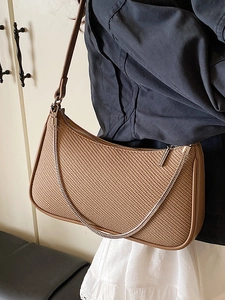 Chic brown woven shoulder bag with silver chain detail in minimalist French style