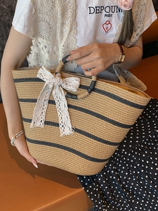 Artistic contrast woven straw tote bag with lace bow and round handles for summer vacation