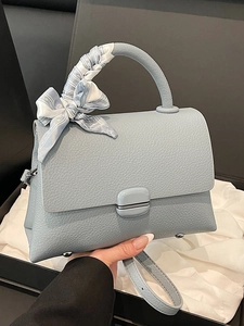 Light blue pebbled leather handbag with silk scarf handle and detachable shoulder strap