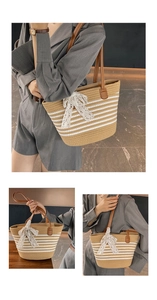 Detail of woven straw tote bag featuring white stripes and a delicate lace bow accent