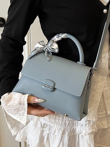 Elegant light blue leather handbag with floral scarf handle and square metal clasp for women