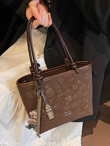 Brown embossed bucket bag with cute patterns and bear pendant for women's daily commute