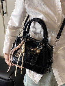 Glossy black faux leather Boston bag with silver abacus charm and crossbody strap