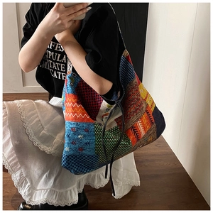 Detail of bohemian patchwork tote bag showing large capacity and colorful patterns