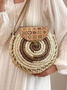 Bohemian round straw crossbody bag with vintage floral pattern flap and leather strap