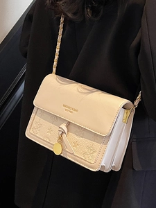 Chic beige textured crossbody bag with gold chain strap and embossed star patterns