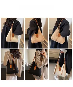 Three woven hobo bags in white, beige, and black featuring V-shaped textures and leather accents