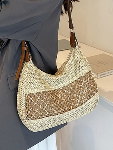 Minimalist straw woven tote bag with two-tone splicing and adjustable leather strap