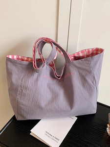 Purple canvas tote bag with pink check lining and Youth embroidery for daily casual use